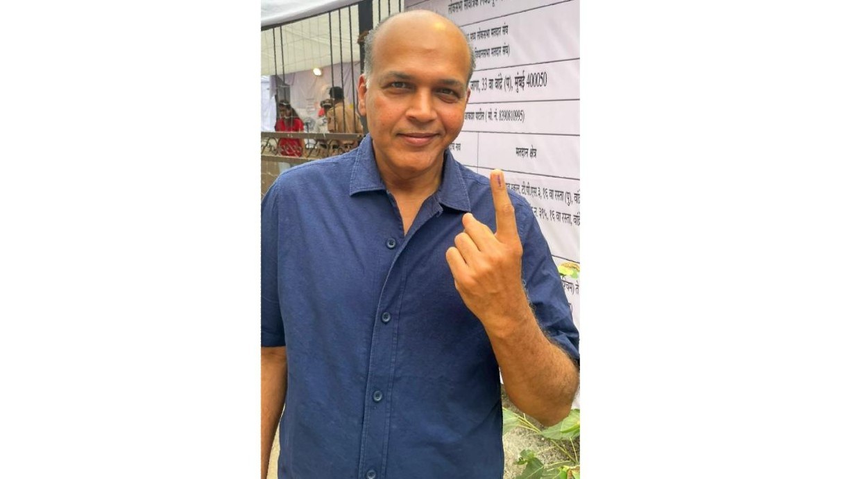 Film director Ashutosh Gowariker shows his inked finger after casting his vote during the fifth phase of Lok Sabha elections, in Mumbai.