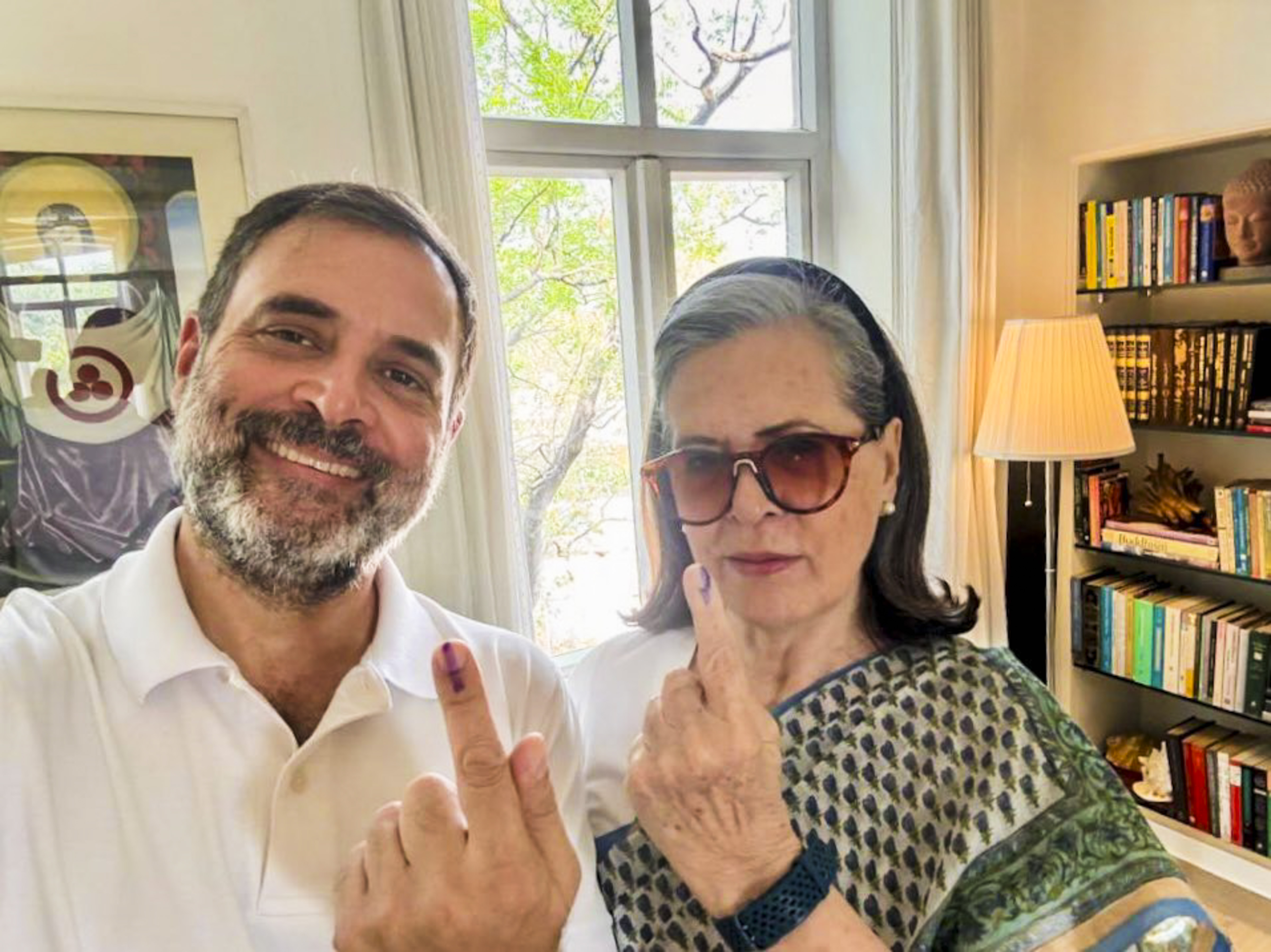 Congress leaders Sonia Gandhi and Rahul Gandhi show their inked fingers after casting their votes during the sixth phase of Lok Sabha elections, in New Delhi, on Saturday.