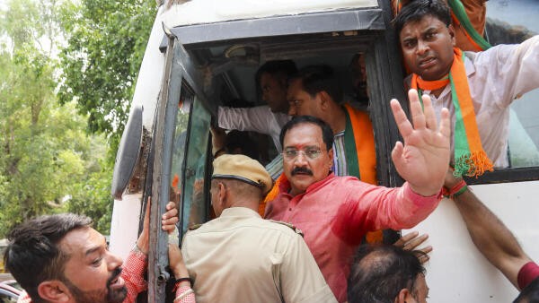 Delhi BJP slams AAP over NIA probe recommended by L-G, stages protest near party office
