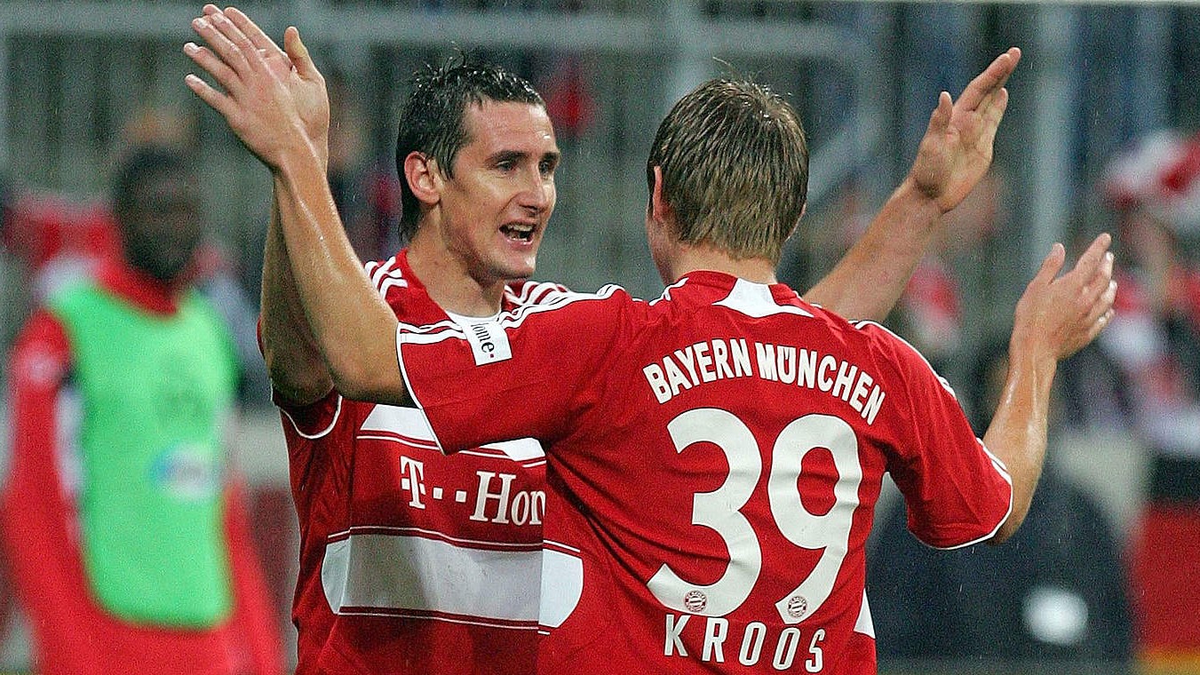 Kroos celebrates with Klose after assisting him on debut.