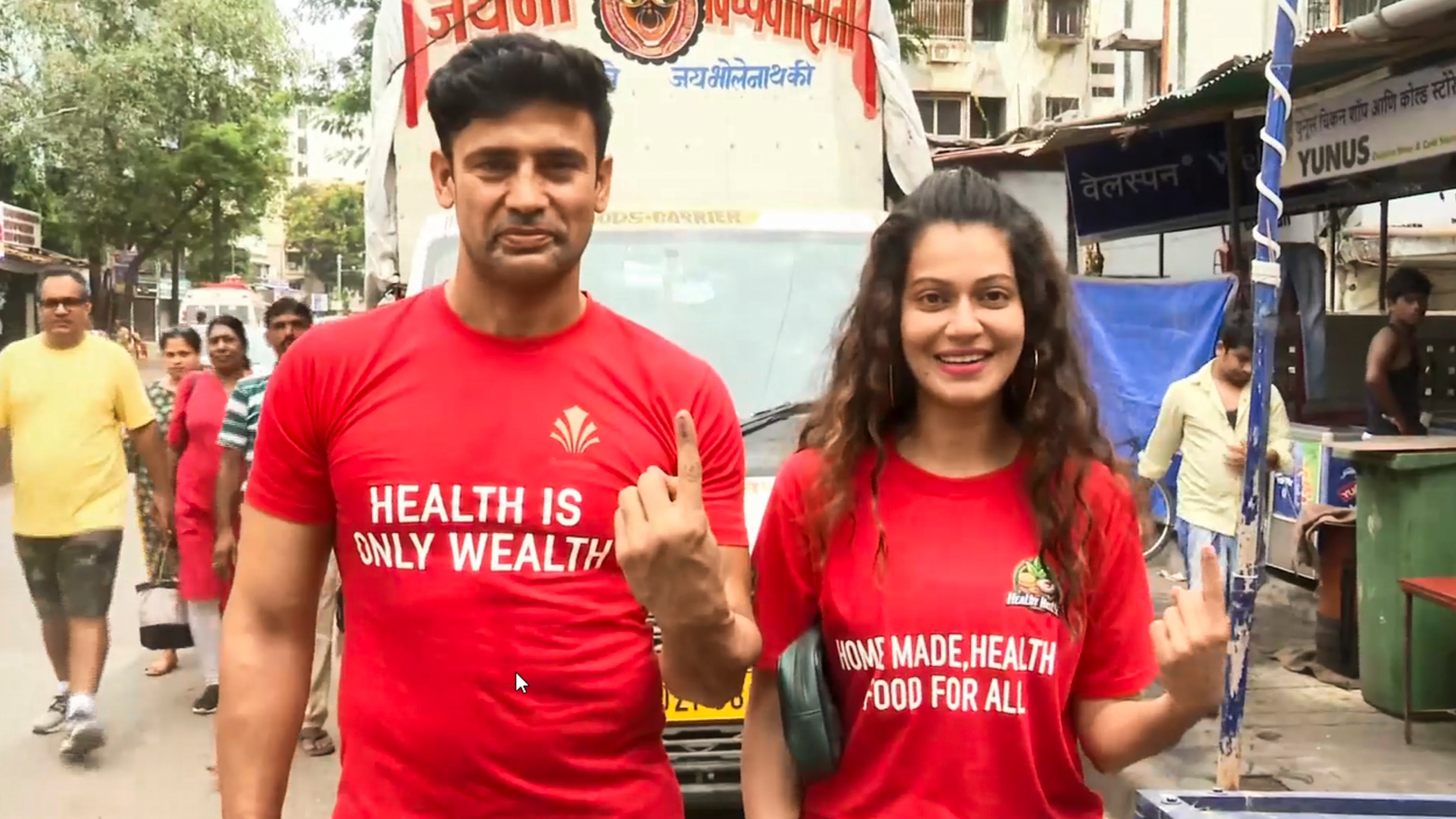 Celebrity couple Sangram Singh and Payal Rohatgi show their ink-marked fingers after casting their votes in the fifth phase of Lok Sabha elections, in Mumbai.