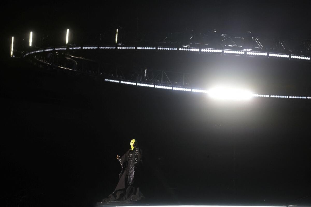 A singer, believed to be Madonna, rehearses ahead of a concert at Copacabana beach, in Rio de Janeiro, Brazil. 