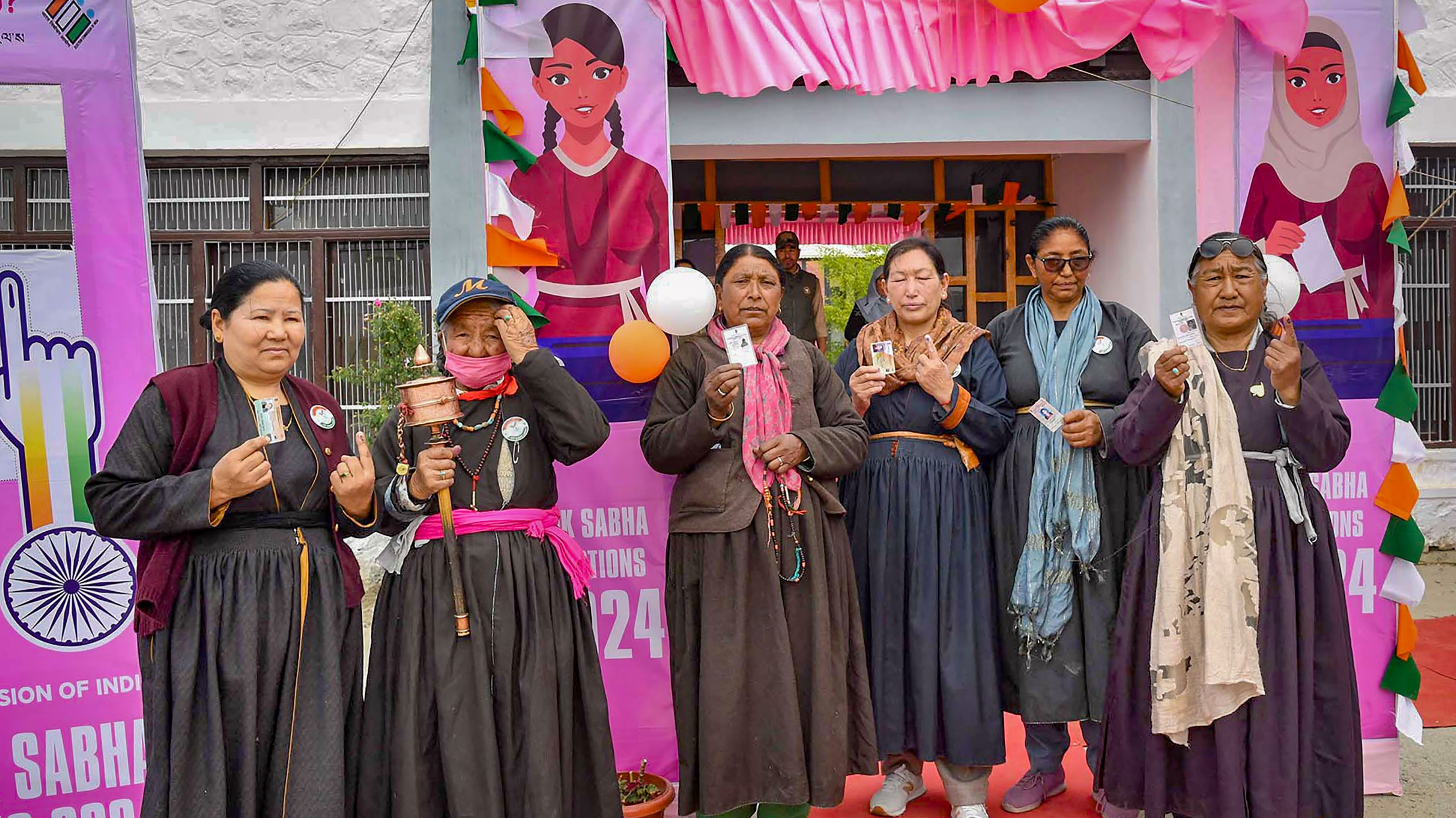 Voters show their fingers marked with indelible ink after casting their votes for the fifth phase of Lok Sabha elections, in Ladakh.