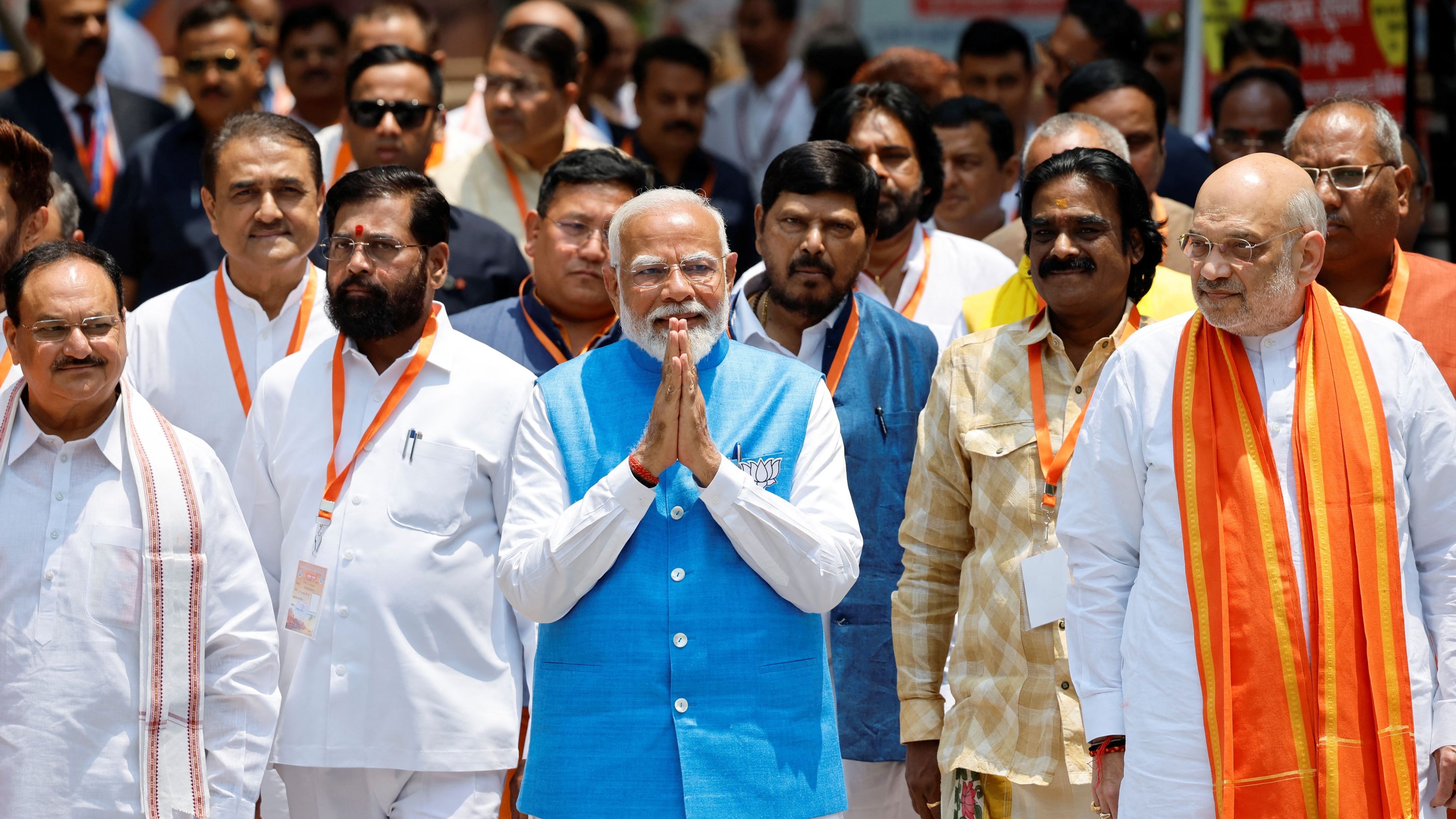 Prime Minister Narendra Modi walks with his party leaders on the day he files his nomination papers for the general elections in Varanasi.