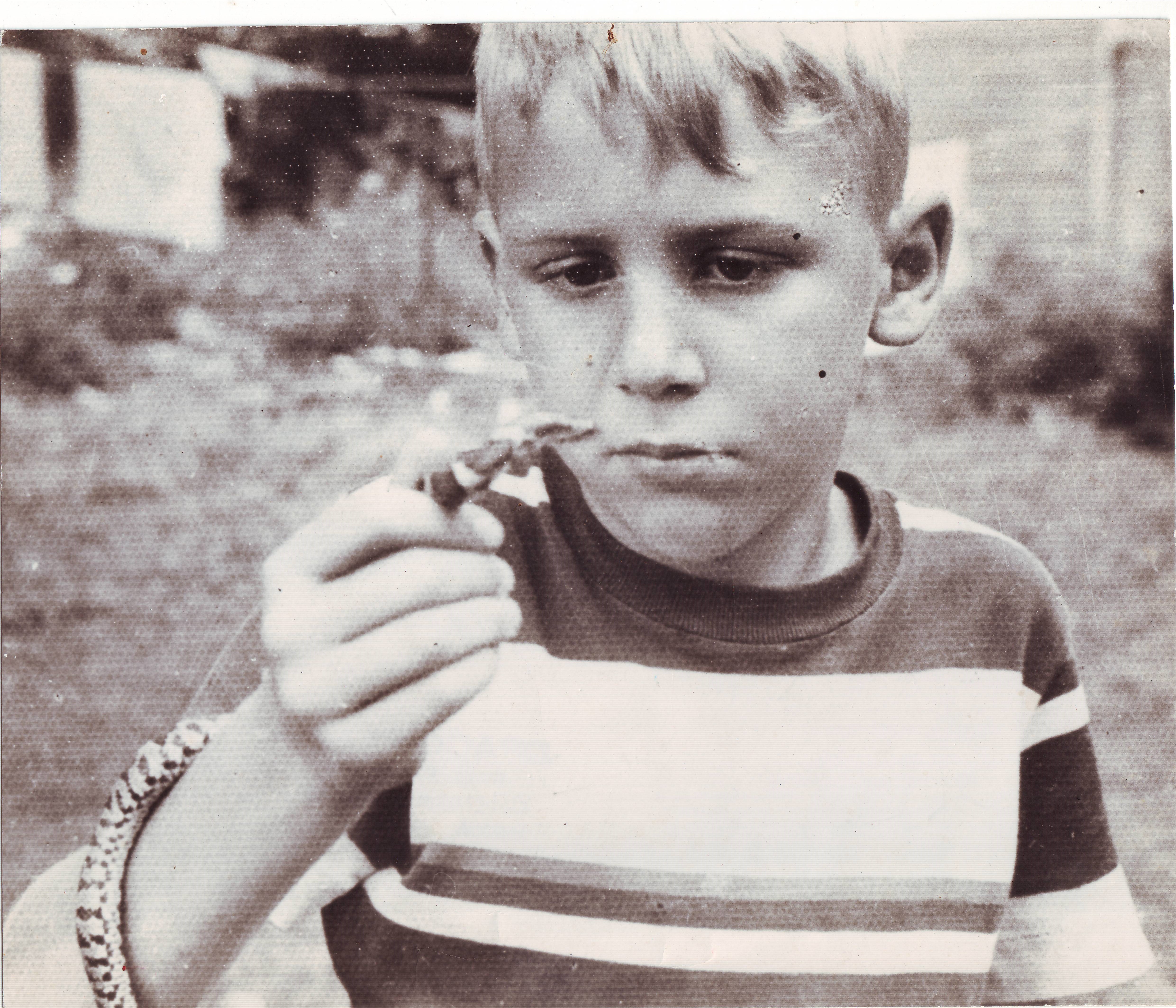Whitaker with a milksnake in 1940s New York State. 