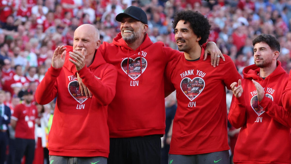 Liverpool manager Juergen Klopp and coaching staff applaud fans after his last match as club manager.