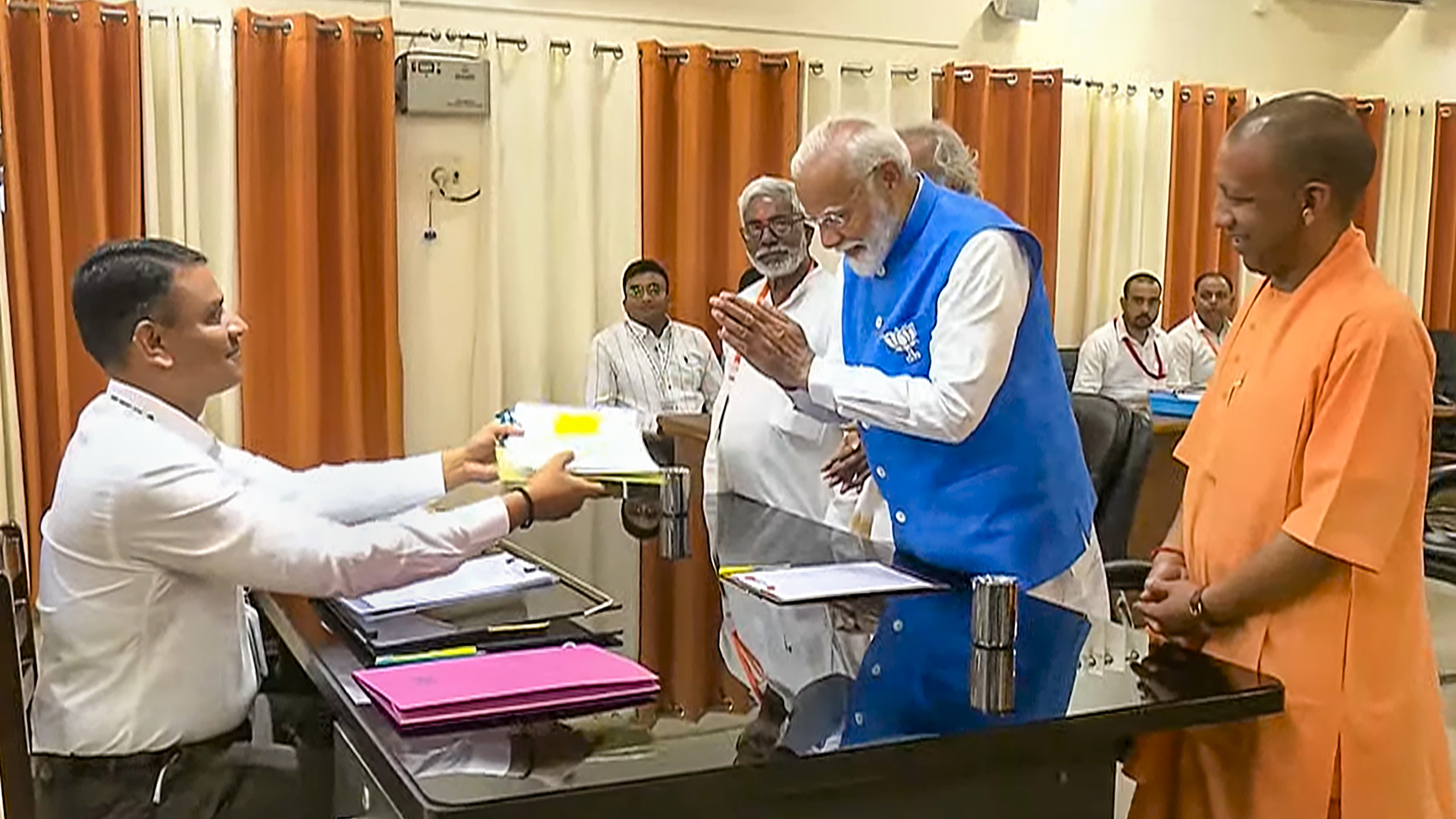 Uttar Pradesh Chief Minister Yogi Adityanath was among those present at the collectorate when Modi filed his papers.