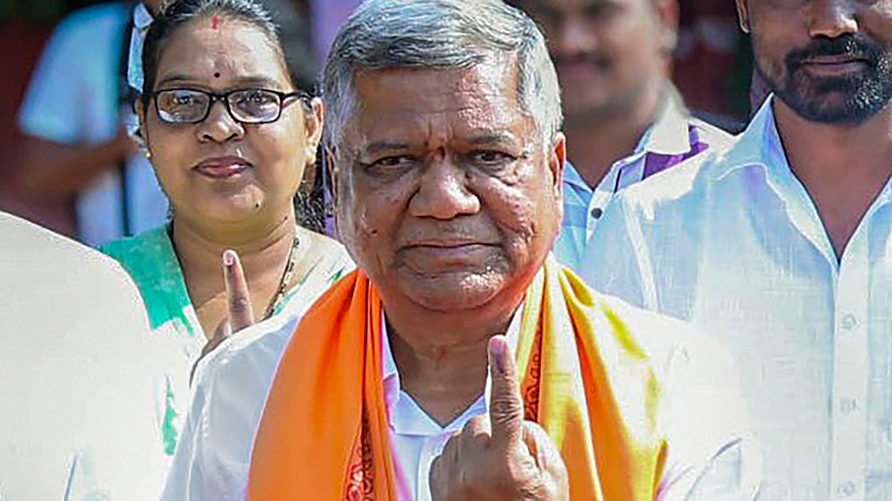 BJP leader Jagadish Shettar shows his inked finger after casting his vote at Visvesvaraya Nagar polling station during the third phase of Lok Sabha polls, in Belgaum.