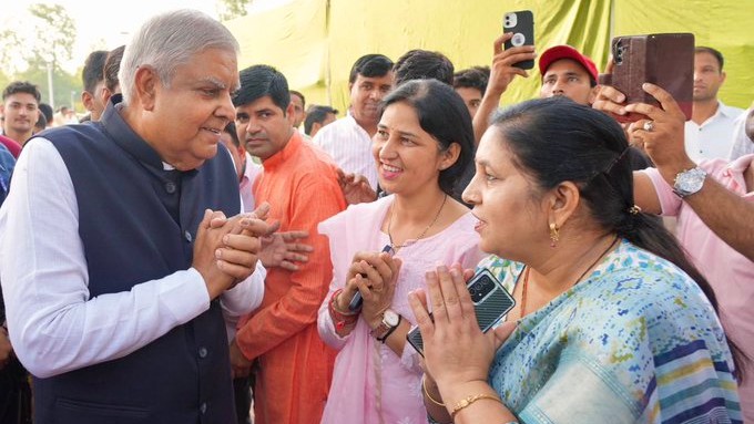 Dhankar is seen speaking to people at Kisan Ghat in New Delhi.