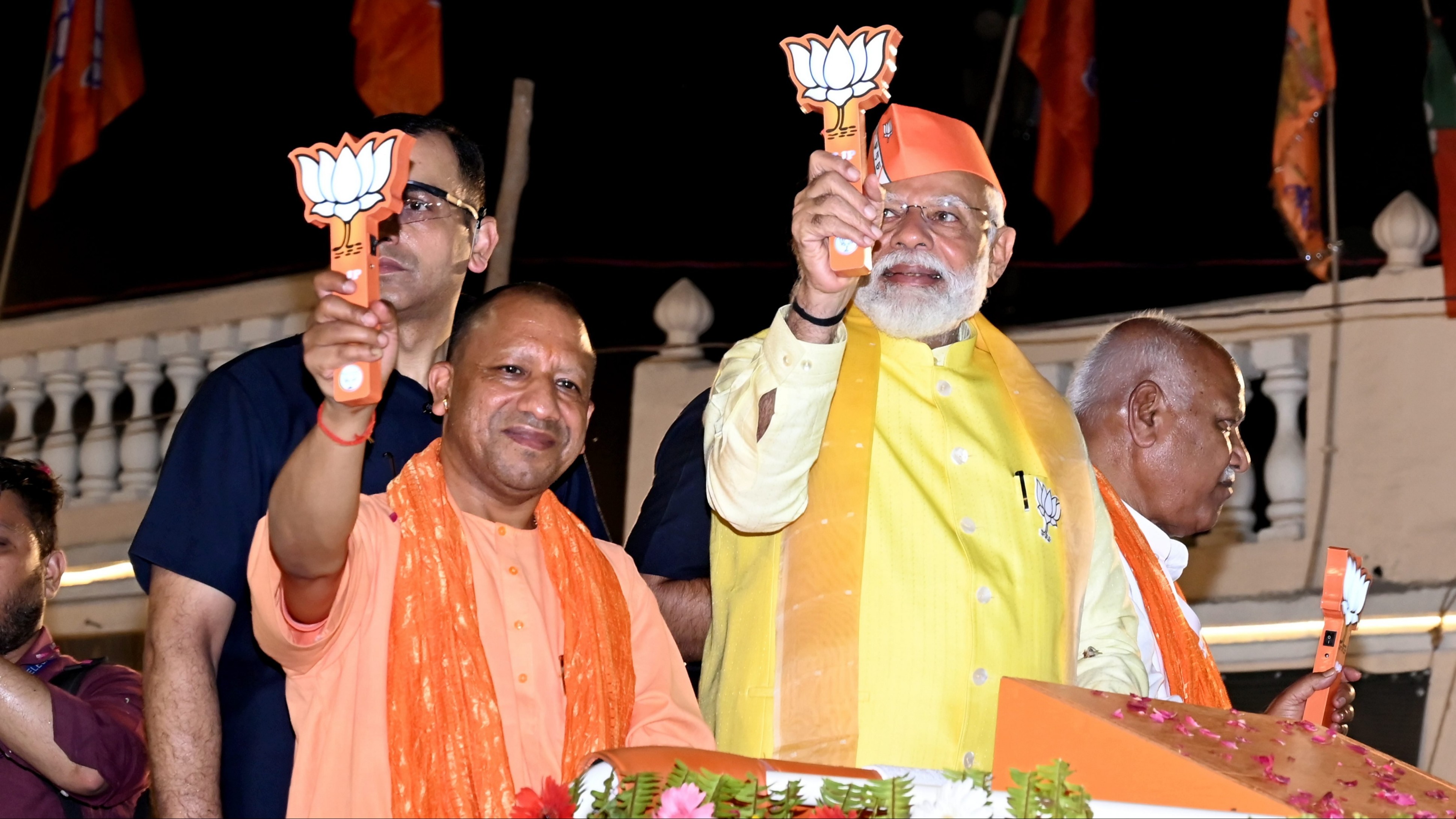 Prime Minister Narendra Modi with Uttar Pradesh Chief Minister Yogi Adityanath during a roadshow for Lok Sabha elections, in Ayodhya.