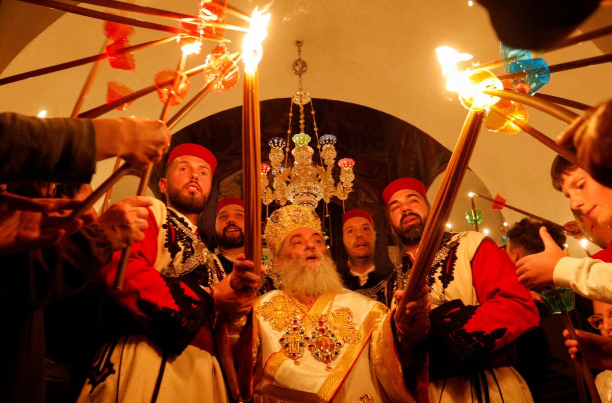 Archimandrite Partenie attends an Orthodox Easter service at St. John the Baptist Monastery, near Mavrovo, North Macedonia. 