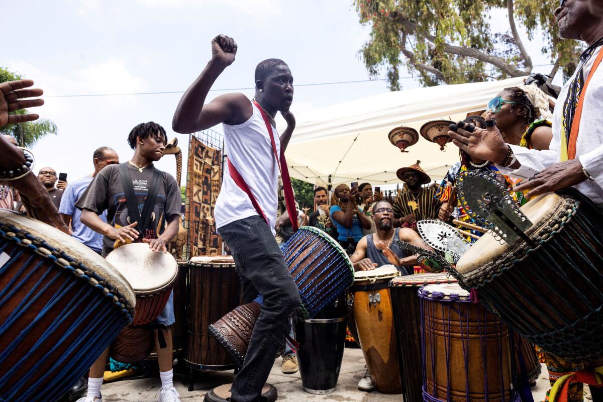 People attend a gathering to mark Juneteenth, which commemorates the end of slavery in Texas, over two years after the 1863 Emancipation Proclamation freed slaves elsewhere in the U.S., in Leimart Park, in Los Angeles, U.S., June 19, 2024. 