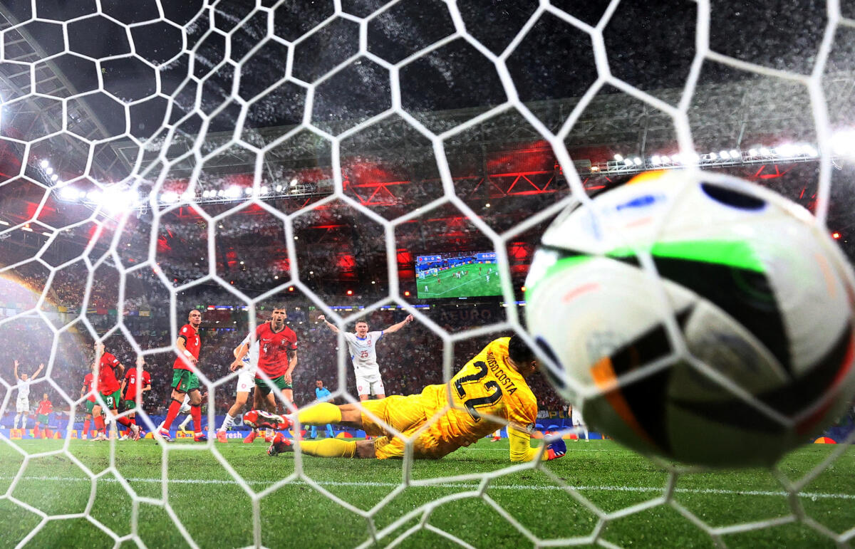 Euro 2024 - Group F - Portugal v Czech Republic - Leipzig Stadium, Leipzig, Germany - June 18, 2024 Czech Republic's Lukas Provod scores their first goal past Portugal's Diogo Costa.