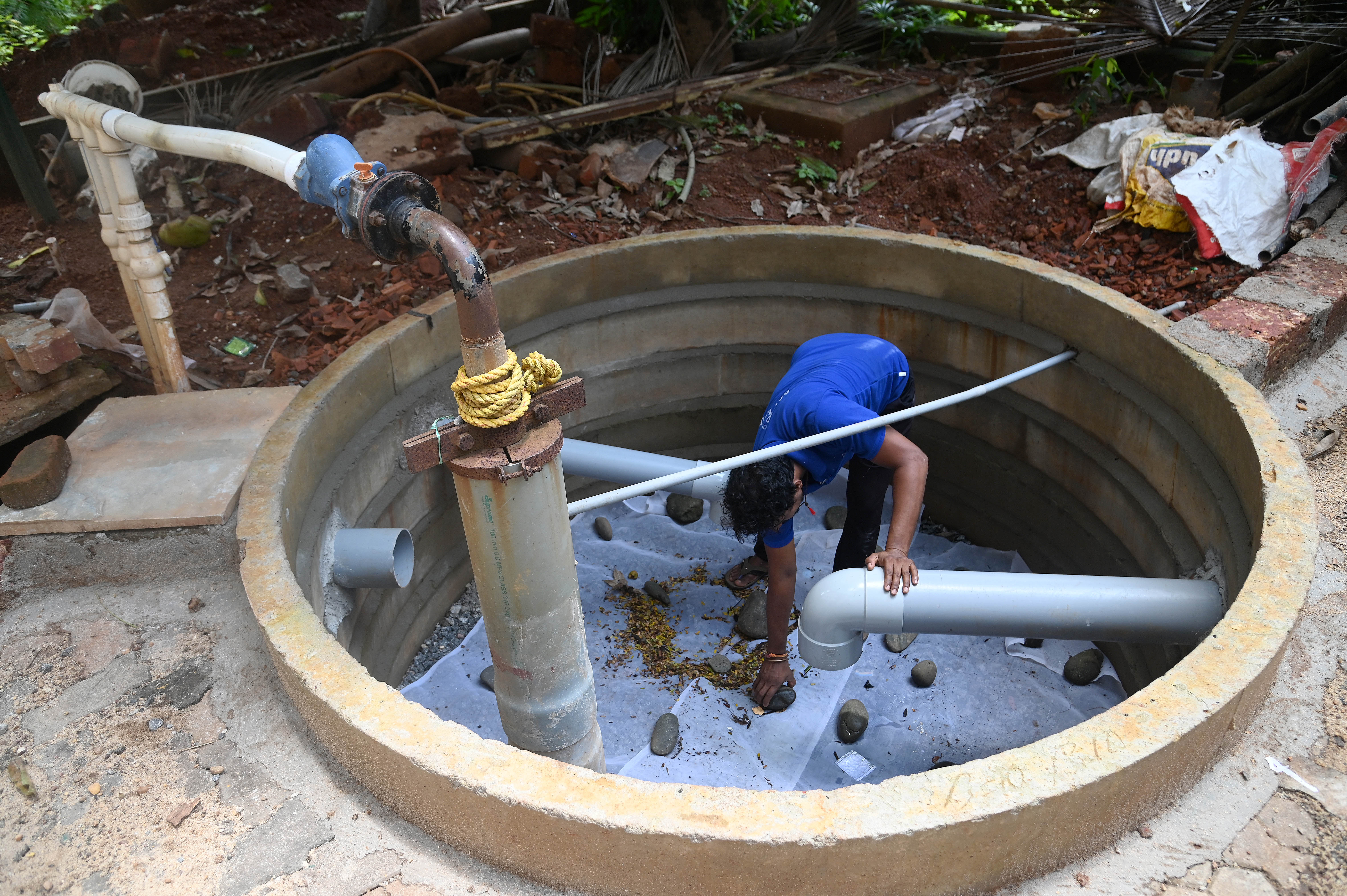 A tank with gravel sand and charcoal is used to filter rainwater. 