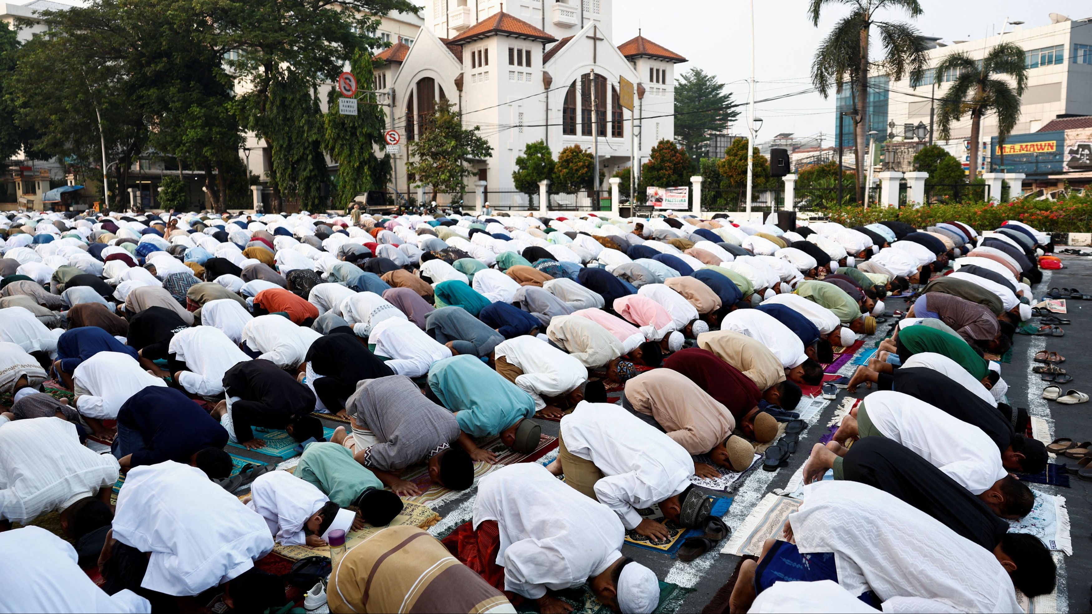 Muslims attend morning mass prayers during Eid ul-Adha celebrations in Jakarta.