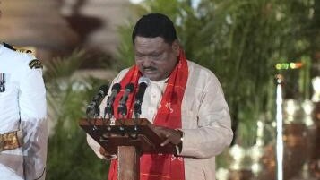 Jual Oram takes oath as union minister.
