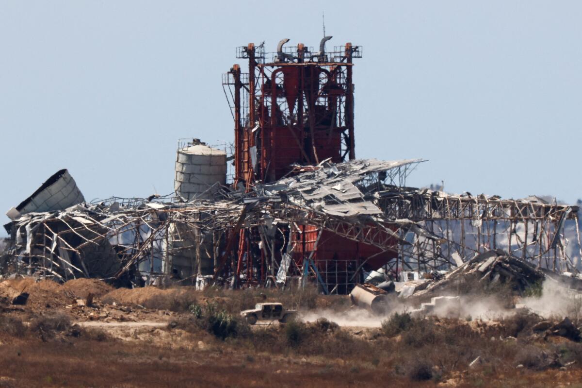 Israeli military vehicles maneuver inside the Gaza Strip, amid the ongoing conflict between Israel and Hamas, as seen from Israel, June 18, 2024. 