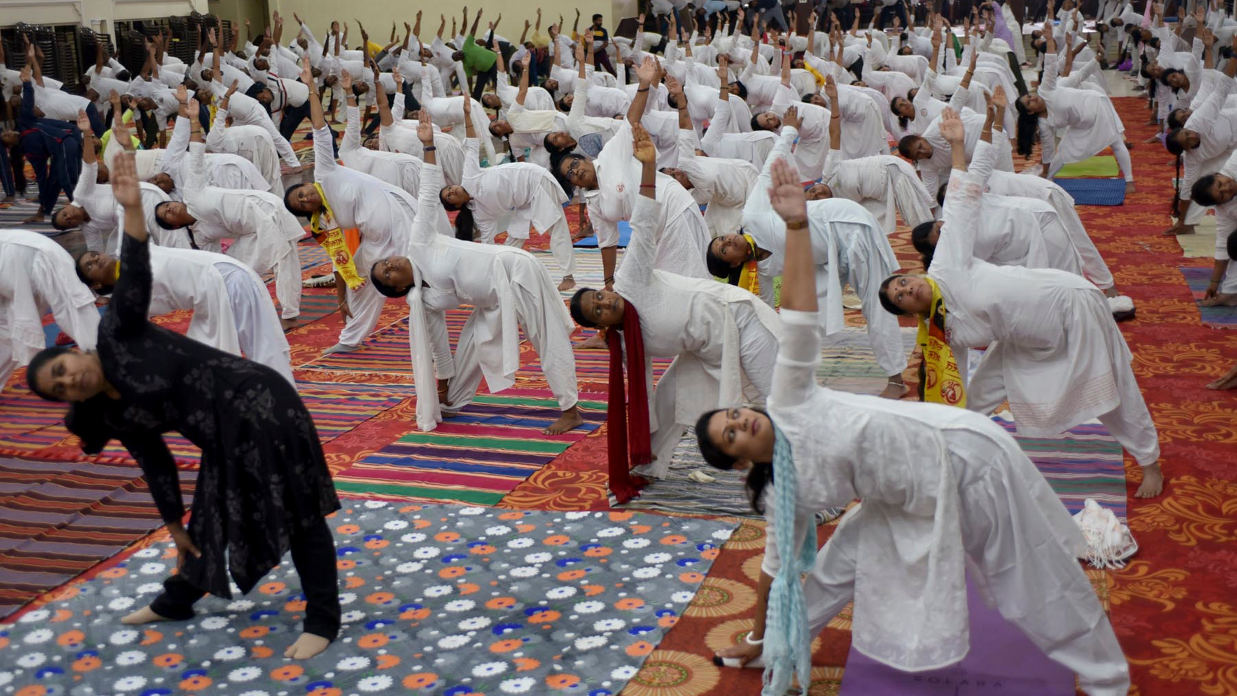 People perform yoga in Chikkamagaluru.