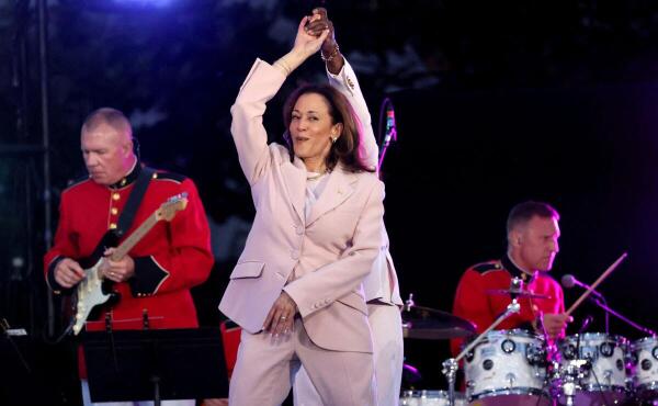 U.S. Vice-President Kamala Harris dances with Kirk Franklin during a Juneteenth concert hosted by U.S. President Joe Biden on the South Lawn at the White House in Washington.