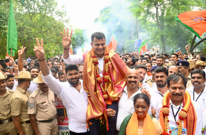 BJP workers lift winning candidate Capt Brijesh Chowta and celebrate the victory near the counting centre at NITK, Surathkal on Tuesday. 