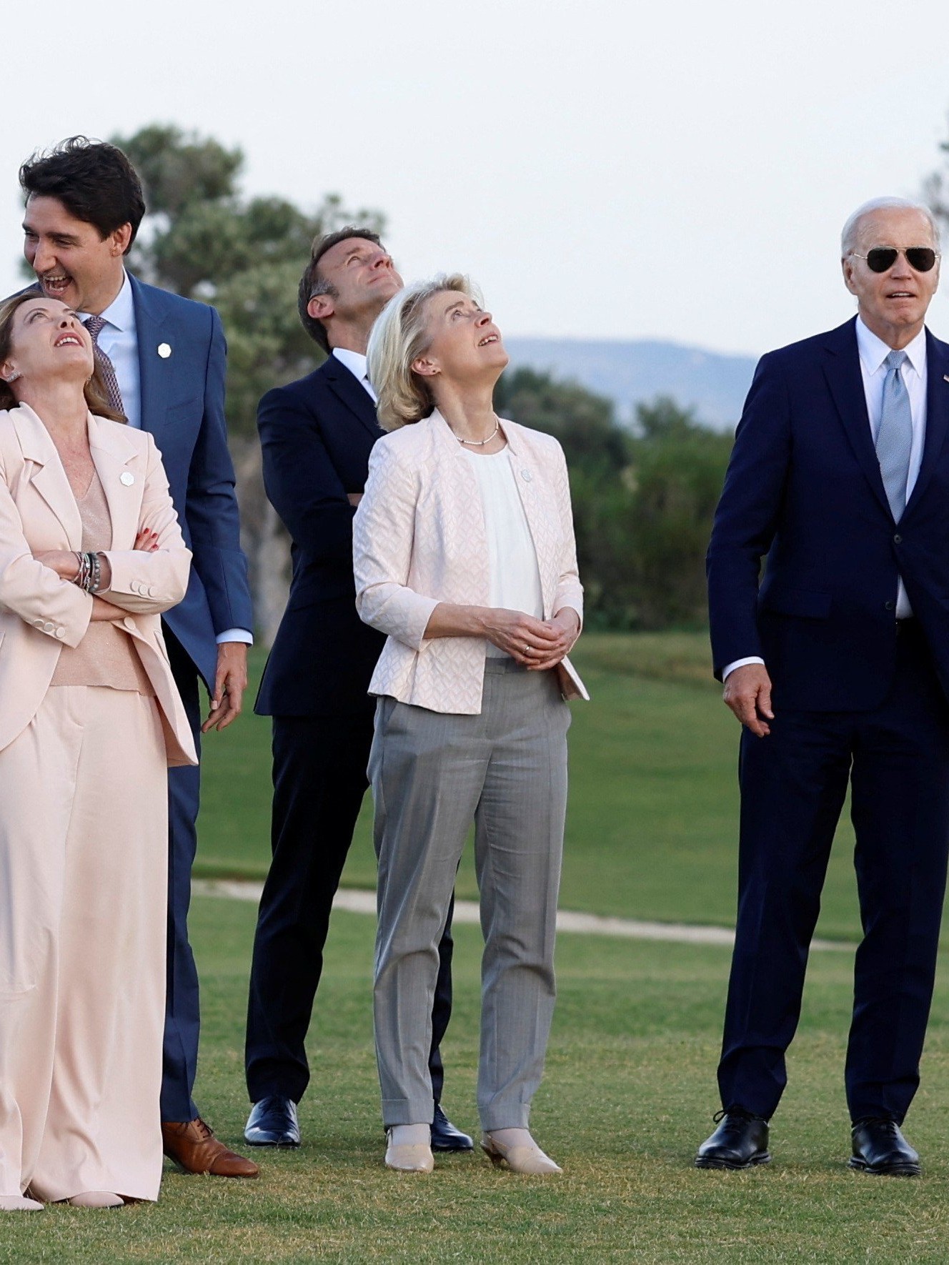 World leaders Rishi Sunak, Justin Trudeau, Emmanuel Macron, Olaf Scholz, Giorgia Meloni, Fumio Kishida, Joe Biden, Ursula von der Leyen and Charles Michel attend a skydiving demonstration, on the first day of the G7 summit, in Savelletri, Italy.