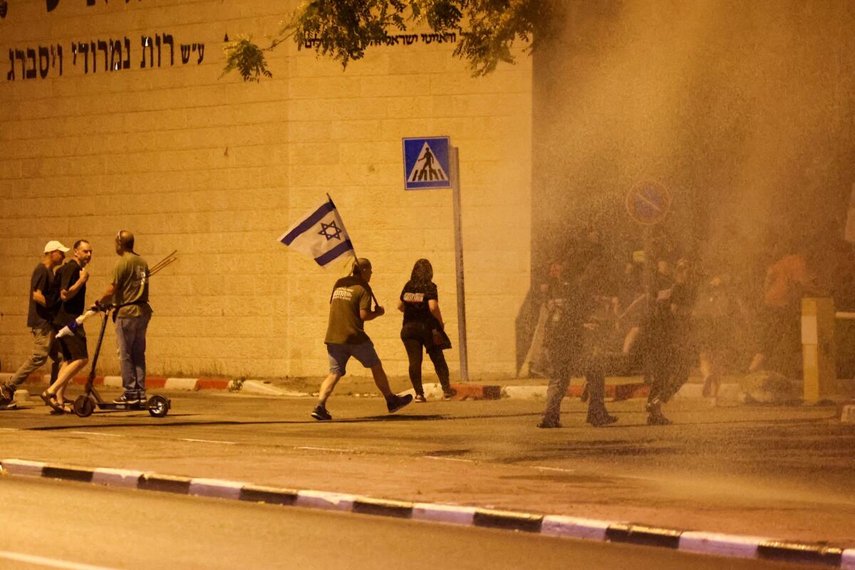 Protesters attend a demonstration against Israeli Prime Minister Benjamin Netanyahu's government, during Israel-Hamas conflict, near the Knesset, Israel's parliament in Jerusalem June 18, 2024. 
