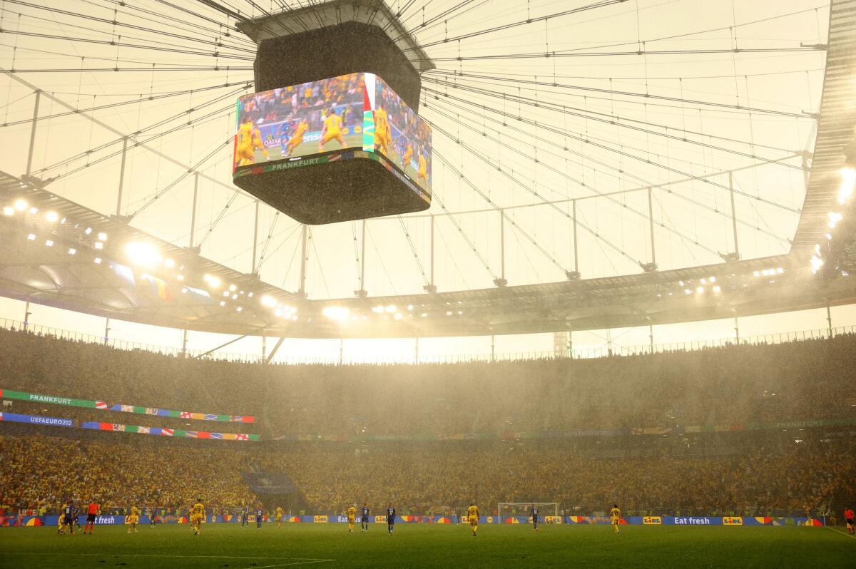 Euro 2024 - Group E - Slovakia v Romania - Frankfurt Arena, Frankfurt, Germany - June 26, 2024 General view as heavy rain is seen inside the stadium during the match.