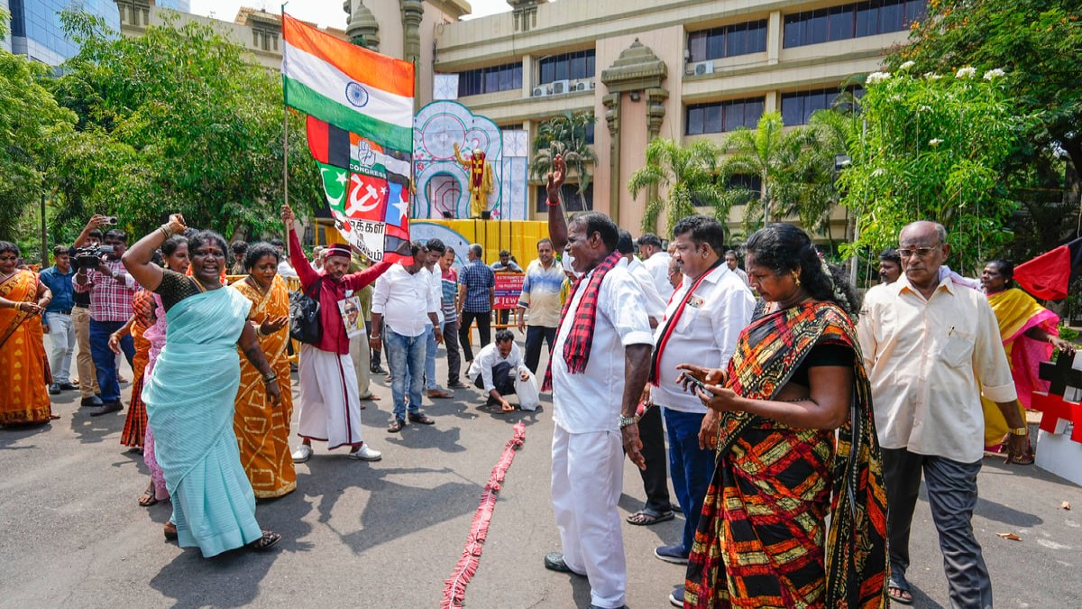 DMK supporters shout slogans as they celebrate party's performance during counting of votes for Lok Sabha elections, at party headquarters, Anna Arivalayam, in Chennai