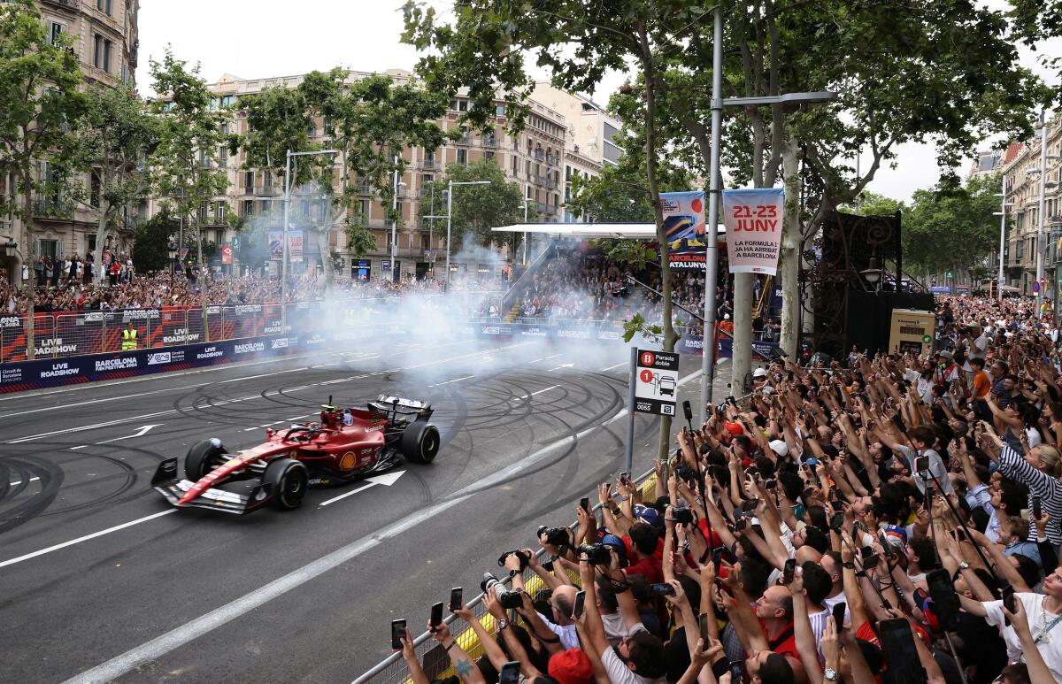 Formula One F1 - Spanish Grand Prix - F1 Road Show at Passeig de Gracia, Barcelona, Spain - June 19, 2024 General view of Ferrari's Carlos Sainz Jr. in action during the F1 Road Show at Passeig de Gracia 
