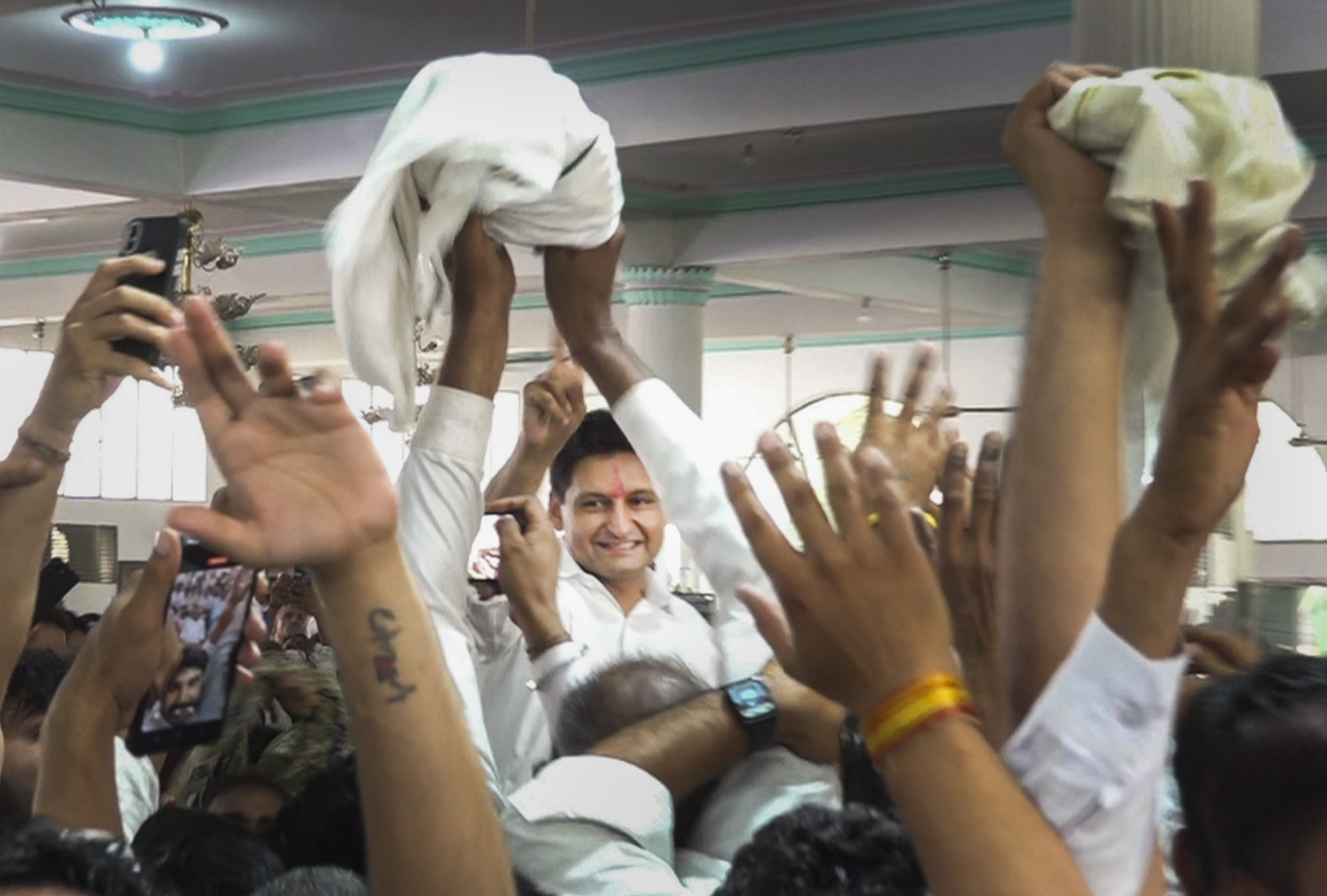 Congress candidate from Rohtak constituency Deepender Hooda being greeted as he leads during counting of votes for Lok Sabha elections, in Rohtak, on Tuesday.