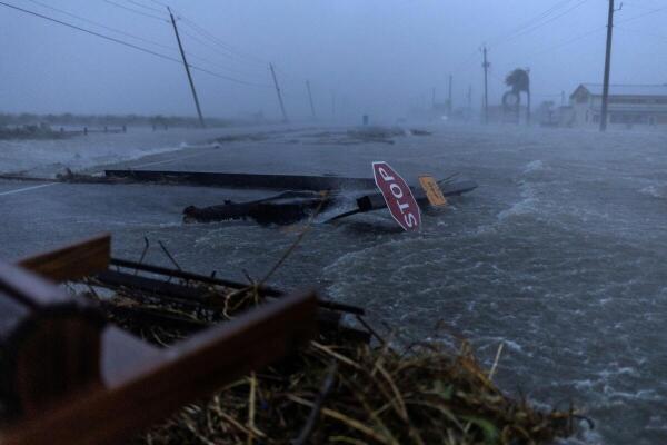 Debris and flood waters from Hurricane Beryl cover the main roadway in Surfside Beach, Texas, US on July 8, 2024.