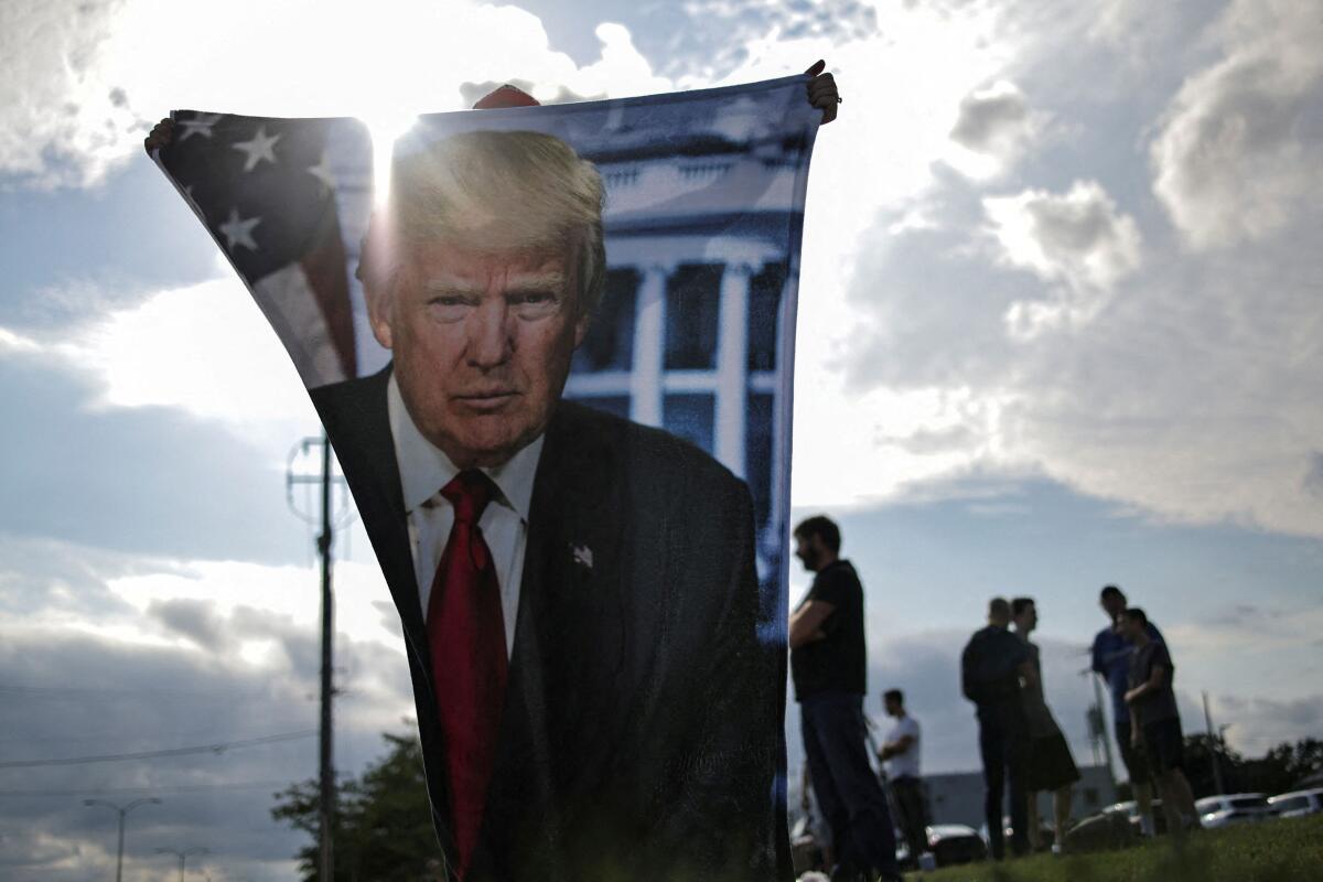 Supporters of Republican presidential candidate and former US President Donald Trump wait for his arrival in Milwaukee, Wisconsin, US.