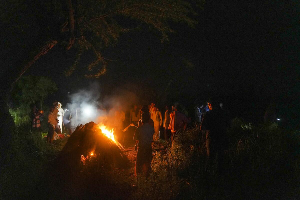 Family members perform last rites of one of the victims of the recent stampede at a 'satsang' in Hathras district.