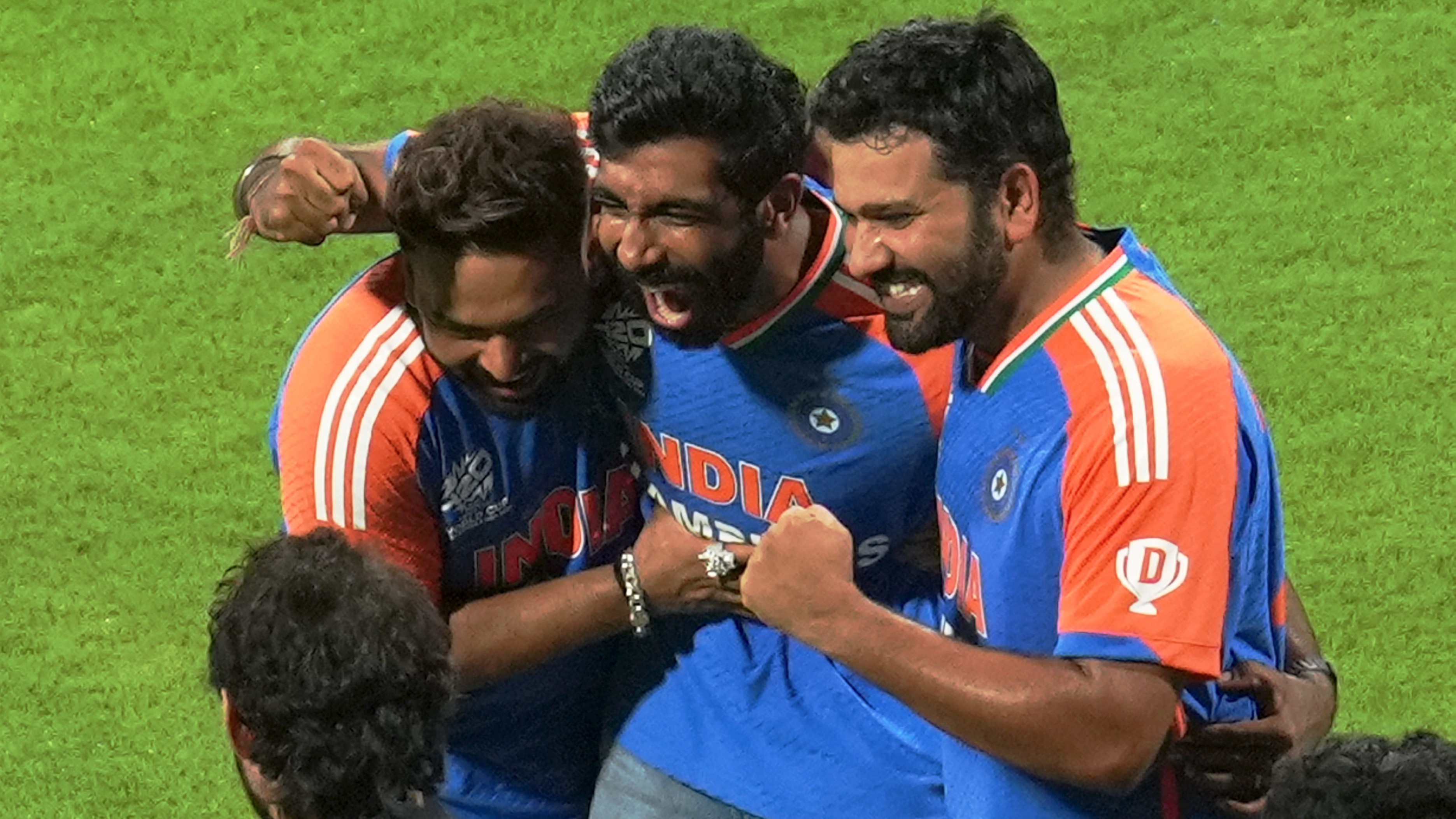 Jasprit Bumrah flanked by Rohit Sharma and Rishabh Pant during their felicitation ceremony at the Wankhede Stadium, in Mumbai.
