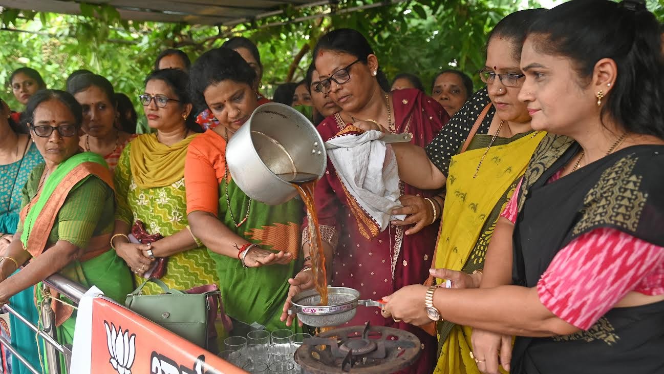 Protesters prepare black tea to protest against hike in milk price