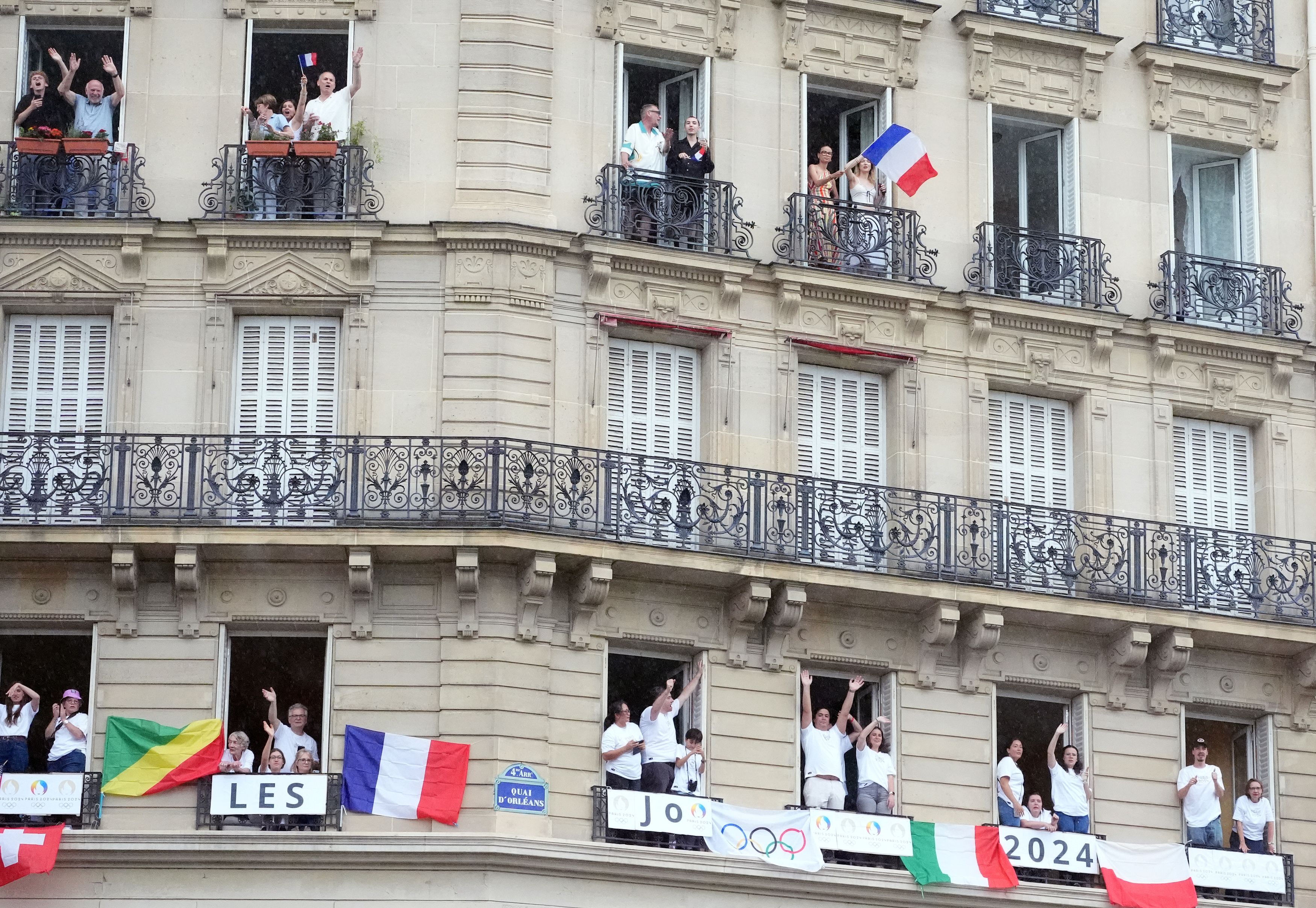 Spectators watch the opening ceremony of the Paris 2024 Olympic Games in Paris, France, July 26, 2024.