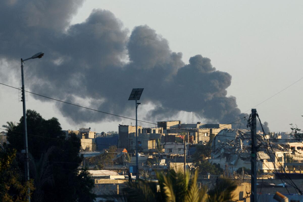 Smoke rises from an Israeli air strike in Rafah as seen from Khan Younis, in the southern Gaza strip July 29, 2024. 