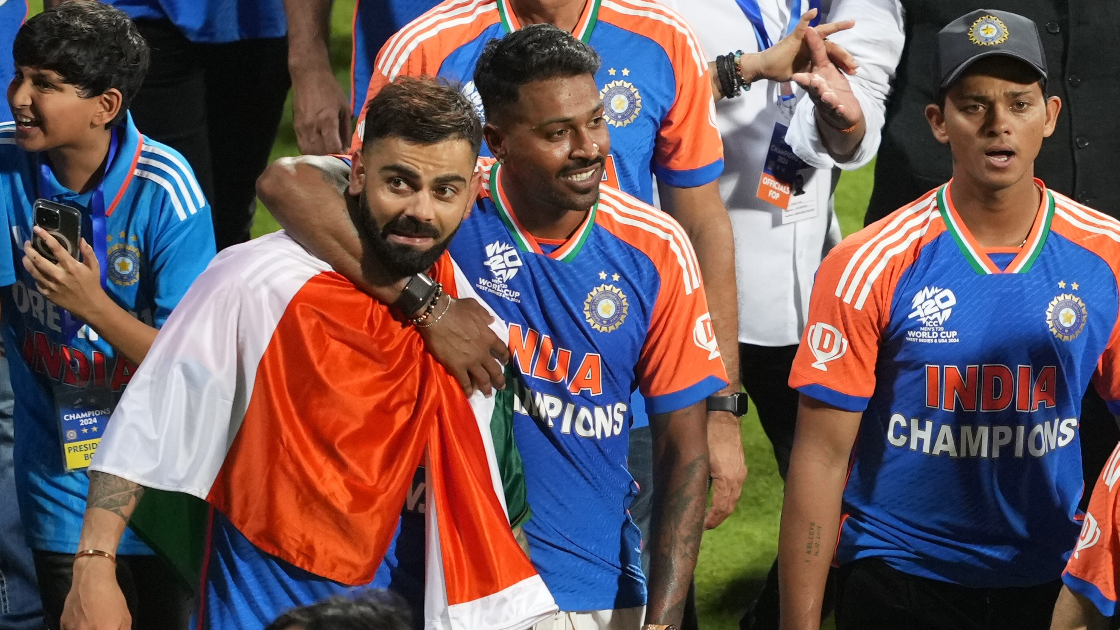 Virat Kohli, Hardik Panya and Yashasvi Jaiswal take a victory lap during their felicitation ceremony at the Wankhede Stadium, in Mumbai.