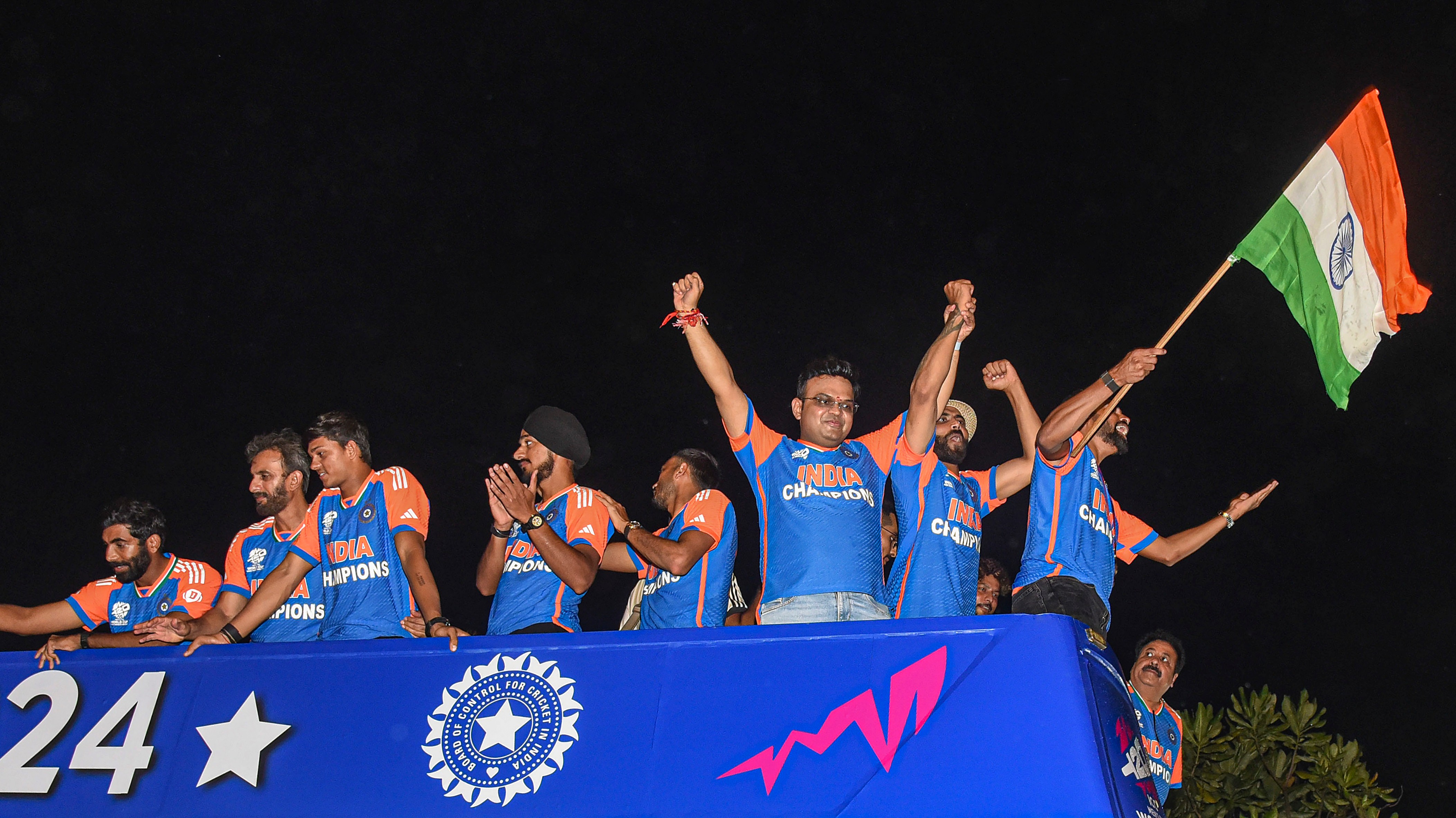 BCCI Secretary Jay Shah with the T20 World champions during their open bus victory parade, in Mumbai.