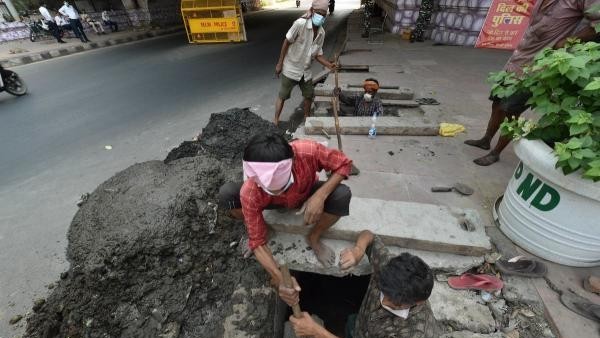 Act decisively to end manual scavenging