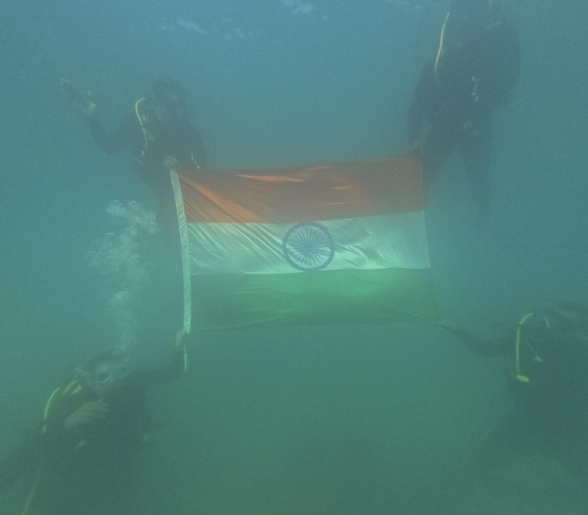 Andman &amp; Nicobar Command personnel unfurl the national flag underwater on the 78th Independence Day at the Andaman &amp; Nicobar Islands.