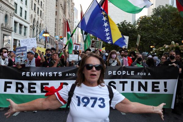 People take part in a protest organised by pro-abortion rights, pro-LGBT rights and pro-Palestinian activists, on the eve of the Democratic National Convention (DNC), in Chicago, Illinois, US.
