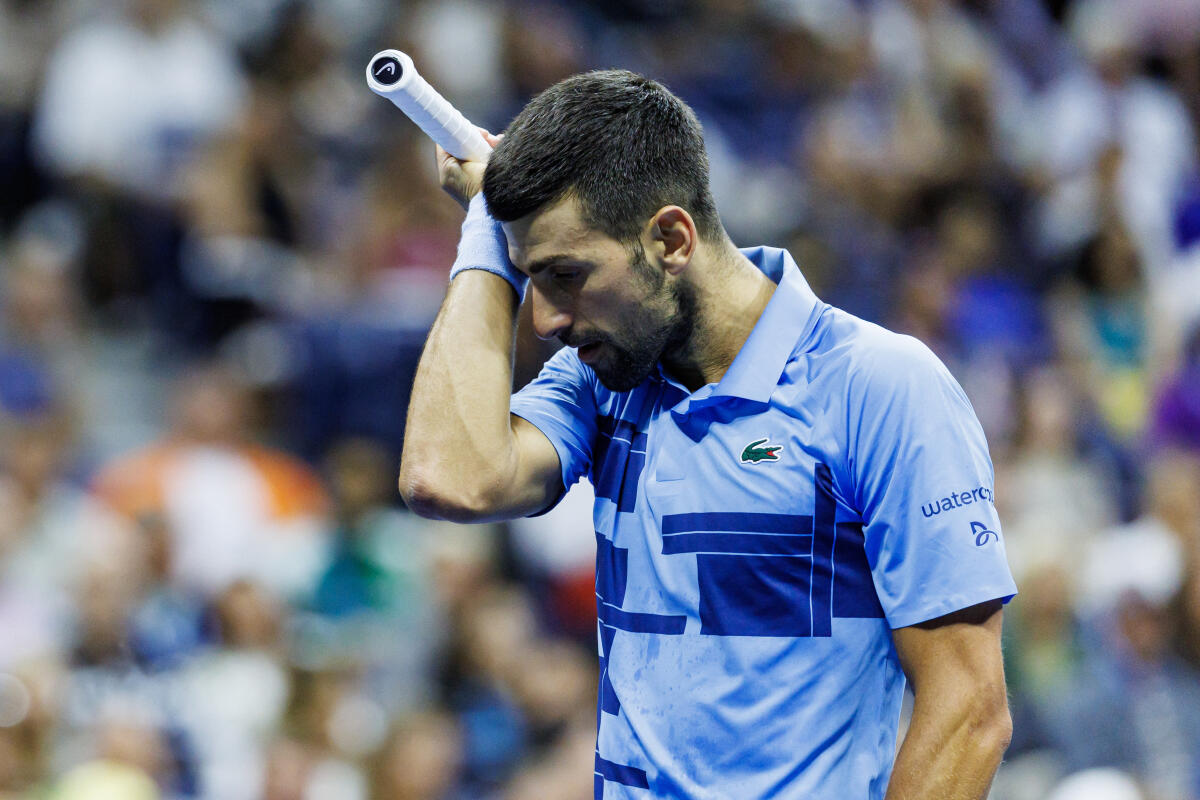Novak Djokovic of Serbia looks dejected during his match against Alexie Popyrin of Australia on day five of the 2024 U.S. Open tennis tournament at the USTA Billie Jean King National Tennis Center.