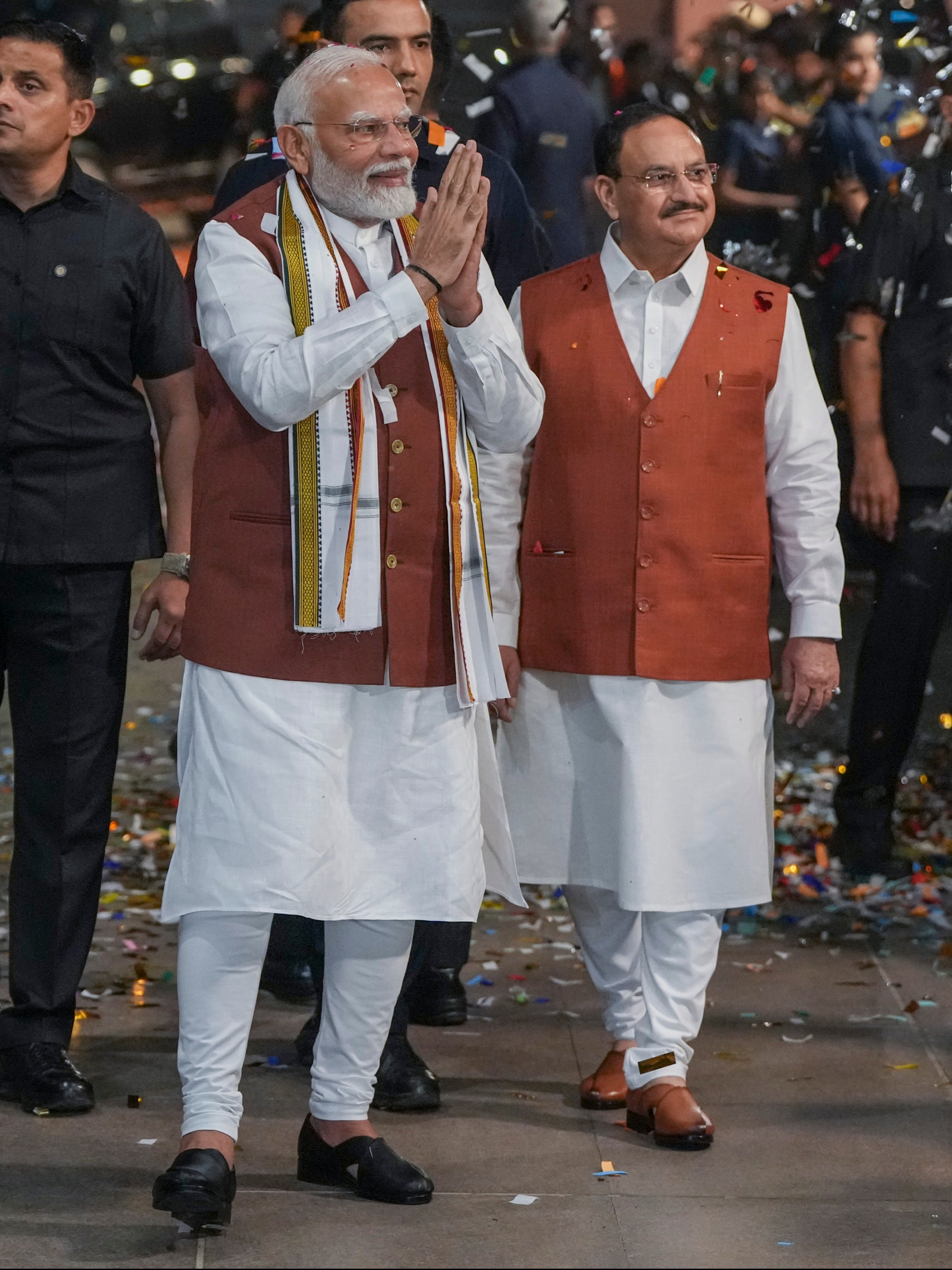 Prime Minister Narendra Modi and JP Nadda greet supporters at the headquarters in New Delhi.