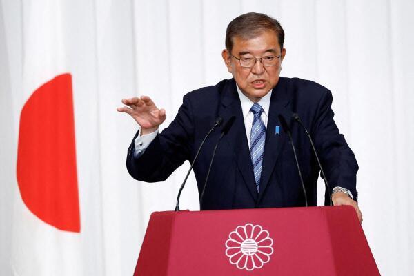 Japan PM battles for survival in parliament vote as Trump looms large