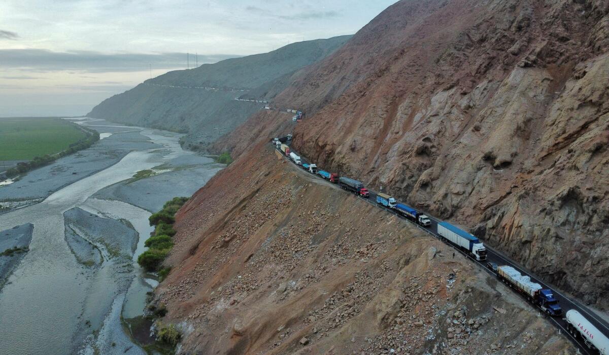 A drone image shows vehicles parked on a mountain road as small-scale miners halt traffic to demand the extension of a program that allows them to operate temporarily, but which authorities say has expanded illegal mining, in Ocona, Peru.