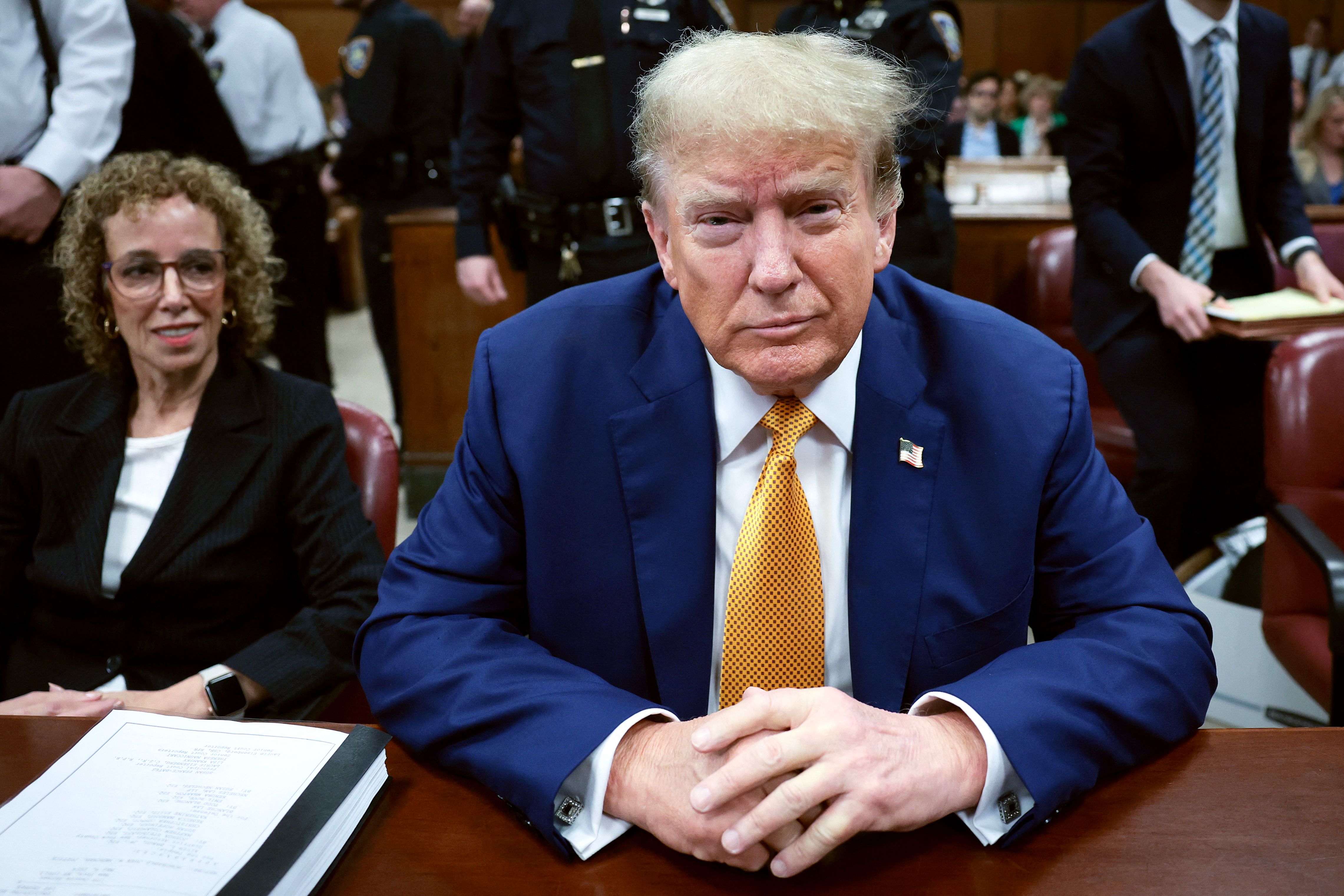 (FILES) Former US President Donald Trump attends his trial for allegedly covering up hush money payments linked to extramarital affairs at Manhattan Criminal Court in New York City on May 7 2024. US President-elect Donald Trump