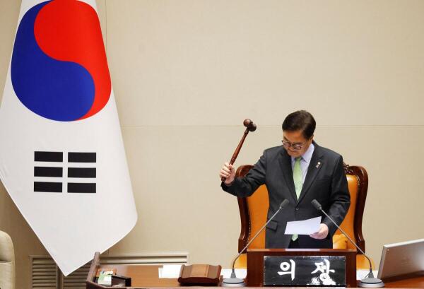 South Korean National Assembly Speaker Woo Won-shik bangs the gavel to announce that "the voting cannot take place" because the quorum was not reached during a plenary session of the impeachment vote of President Yoon Suk Yeol at the National Assembly in Seoul, South Korea, 7 December, 2024.