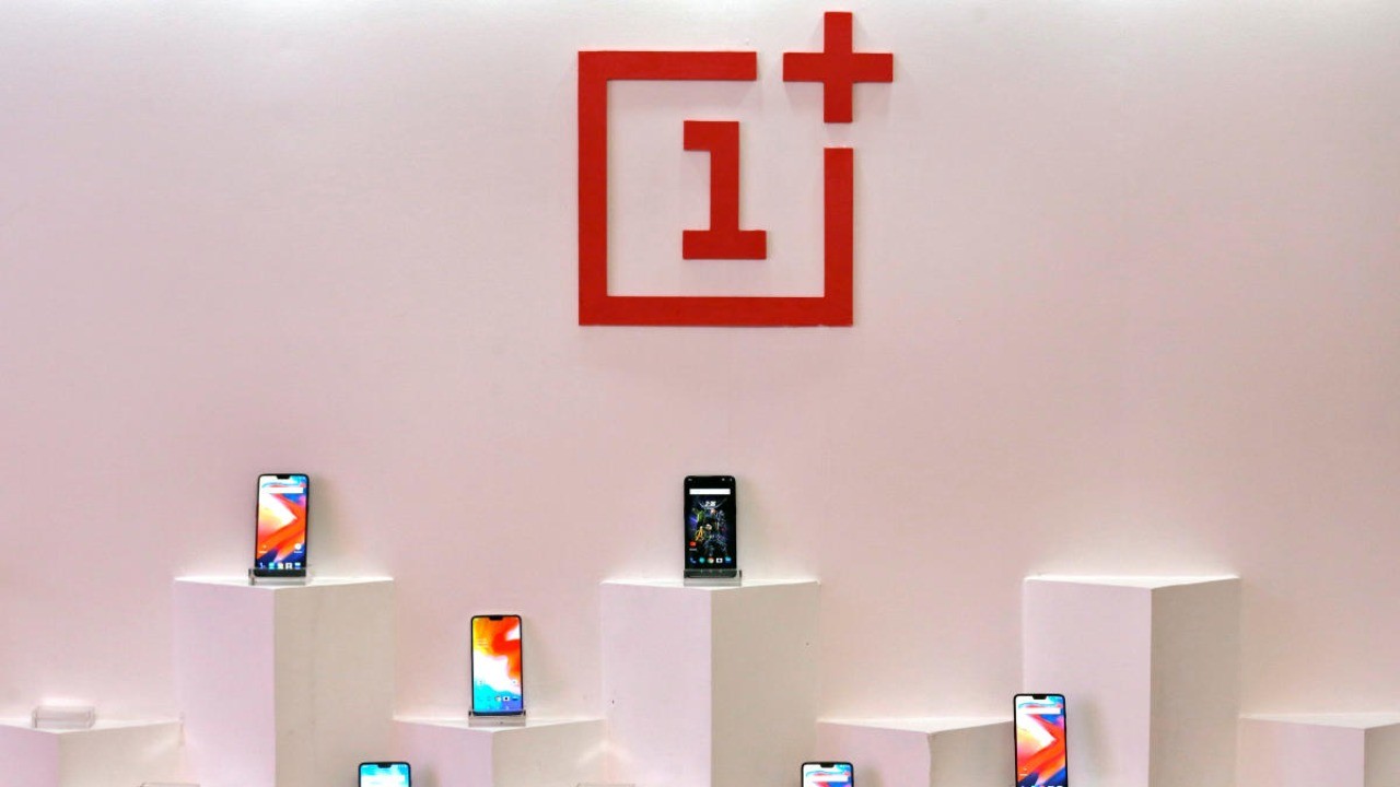 OnePlus mobile phones are seen on display during a press briefing. 
