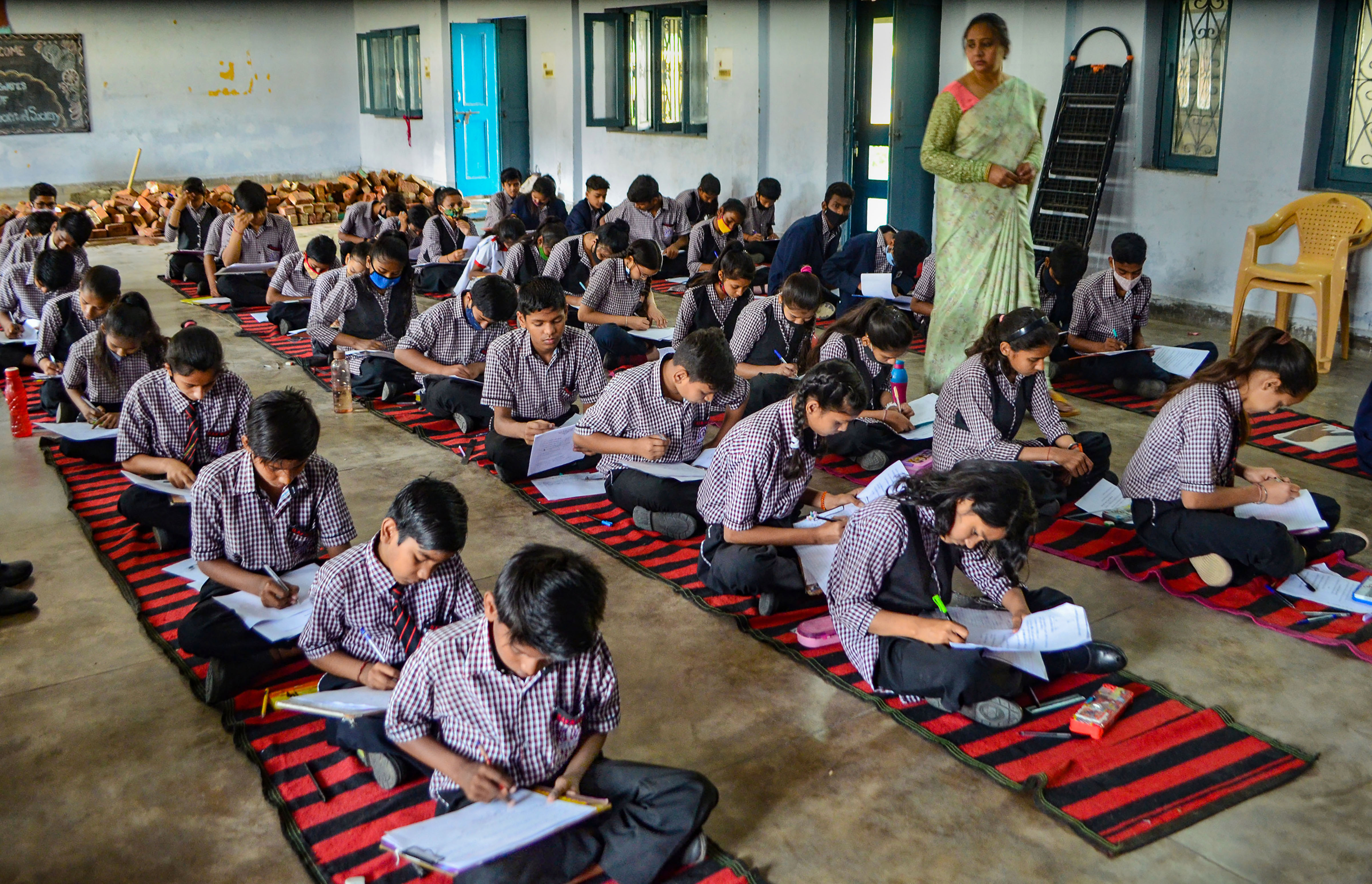 Students appear for an exam at a Gurugram school.